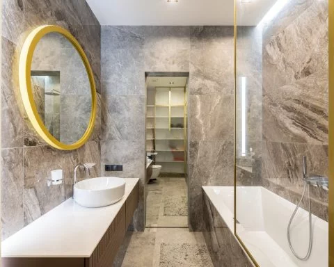 bathroom interior with sink on counter near mirror and bath