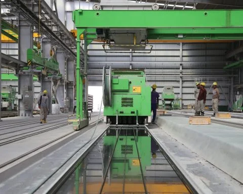 people stands near green metal industrial machine